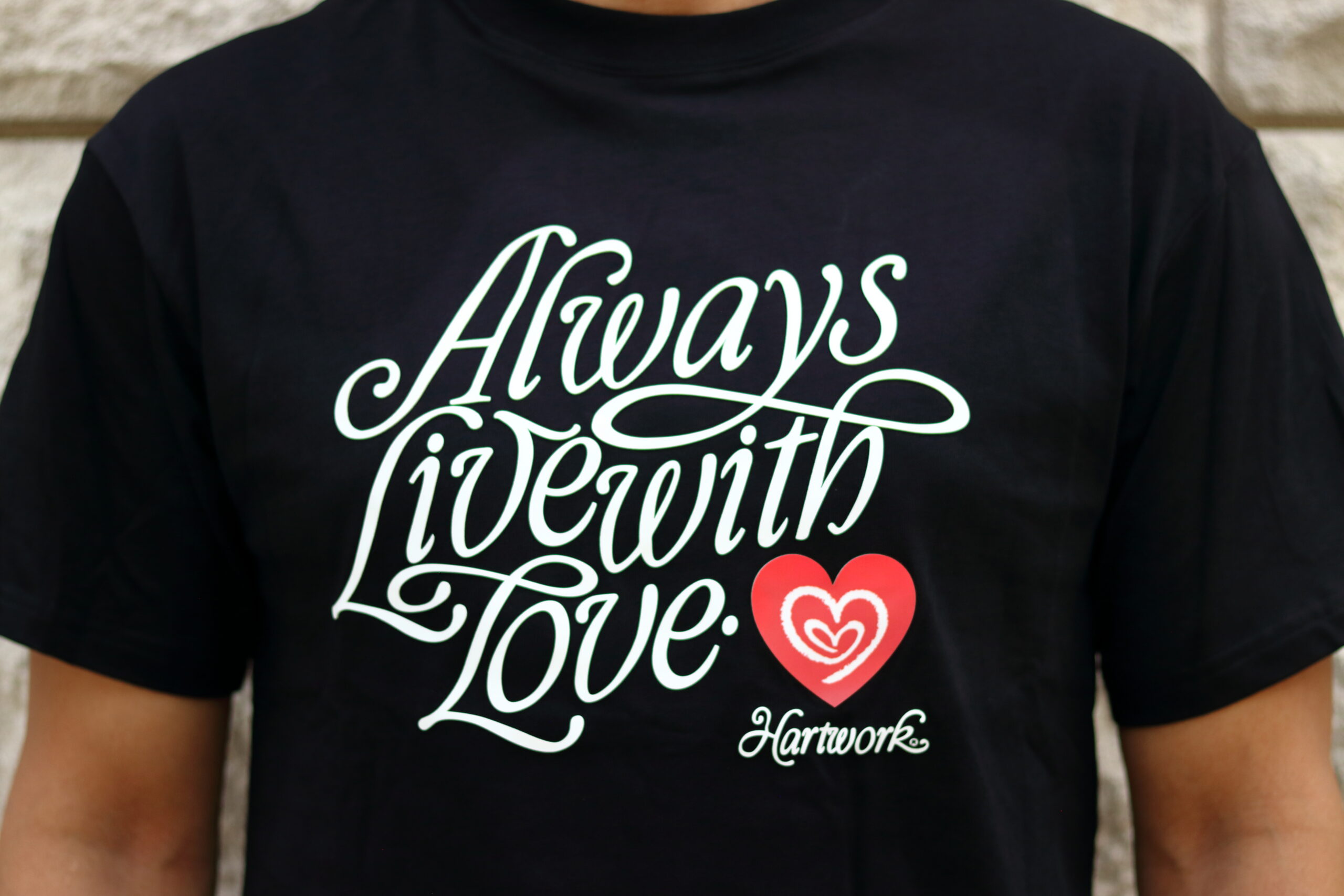 Model wearing the Hartwork Always Live With Love Tee